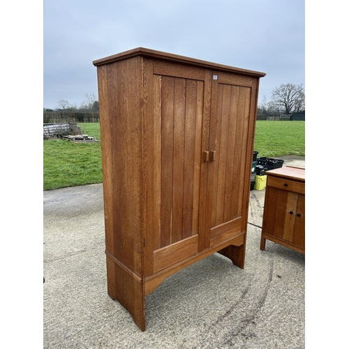 381 - A large arts and crafts style oak laundry cupboard 122x53x185