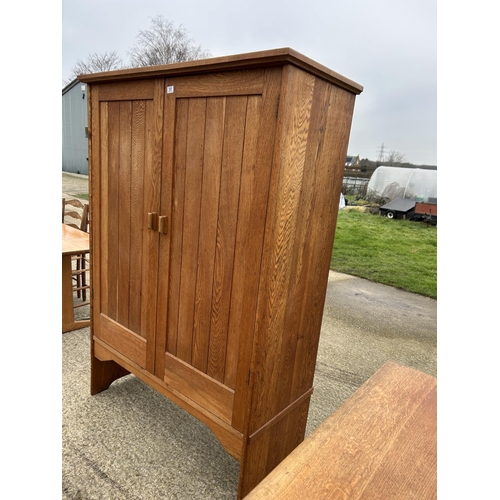 381 - A large arts and crafts style oak laundry cupboard 122x53x185