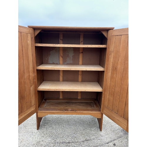 381 - A large arts and crafts style oak laundry cupboard 122x53x185