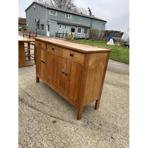 382 - A arts and crafts style oak three drawer sideboard 138x45x90