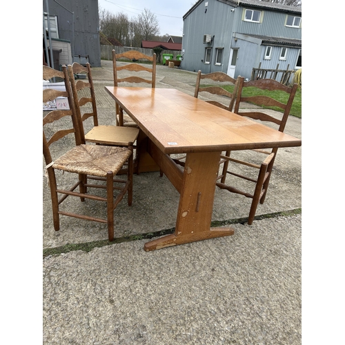 383 - An arts and crafts style oak refectory dining table together with five ladder back chairs  177x80x77