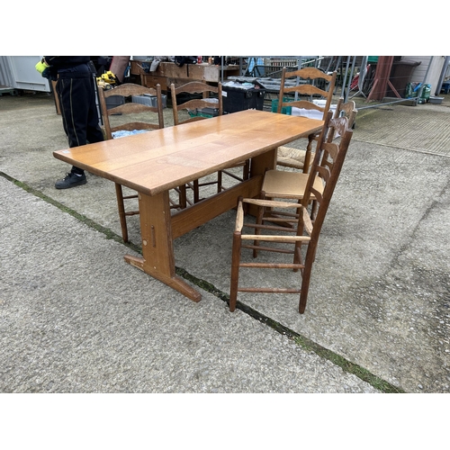 383 - An arts and crafts style oak refectory dining table together with five ladder back chairs  177x80x77