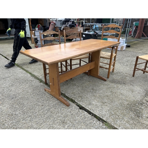 383 - An arts and crafts style oak refectory dining table together with five ladder back chairs  177x80x77