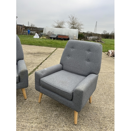 390 - A pair of modern grey upholstered armchairs