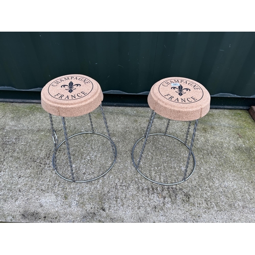 391 - A pair of wirework champagne cork themed stools with cork seats