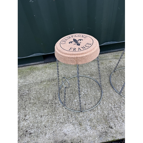 391 - A pair of wirework champagne cork themed stools with cork seats