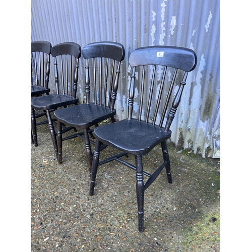 41 - Four black painted stick back chairs