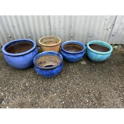 413 - A collection of five large glazed garden pots