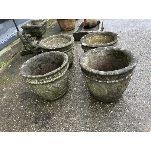 417 - A set of four ornate circular concrete planters each height 36 cms, diameter of top 42cms