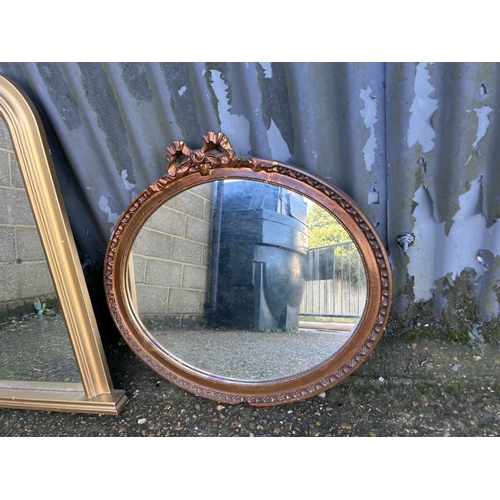 42 - A large gold over-mantle mirror together with an ornate circular mirror