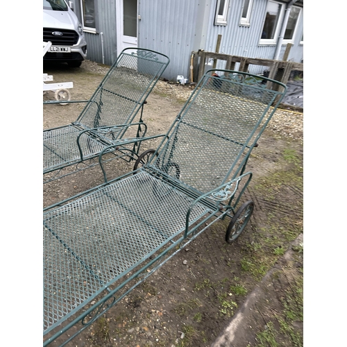 420 - A pair of vintage style green wirework sun loungers