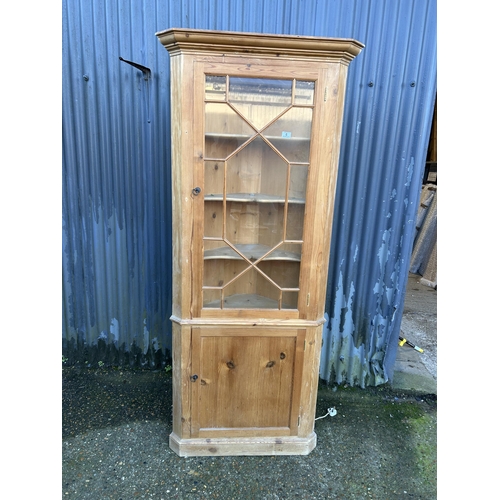 6 - A country pine corner cabinet