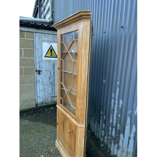 6 - A country pine corner cabinet