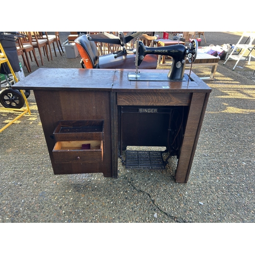 61 - A singer cabinet sewing machine