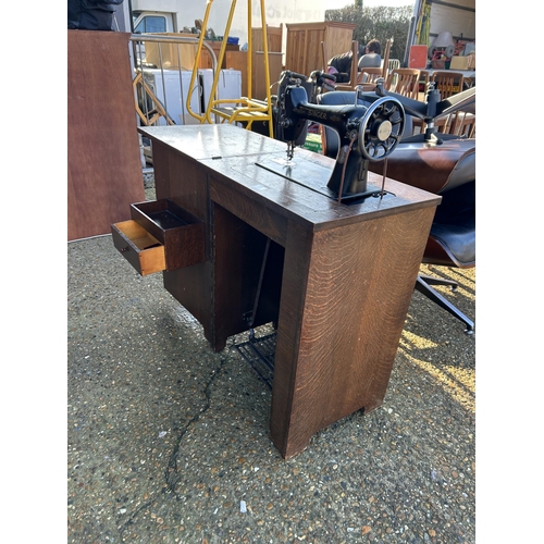 61 - A singer cabinet sewing machine