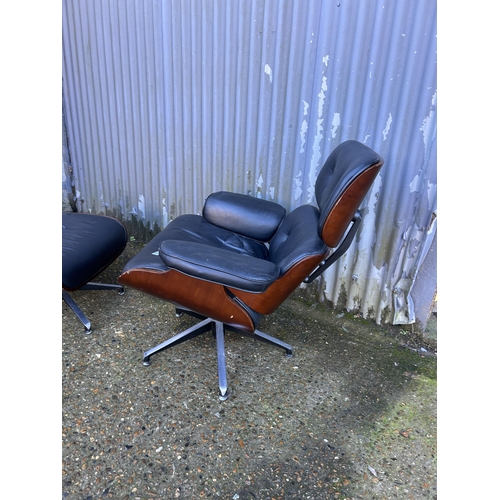 62 - A reproduction EAMES swivel chair and Ottoman footstool