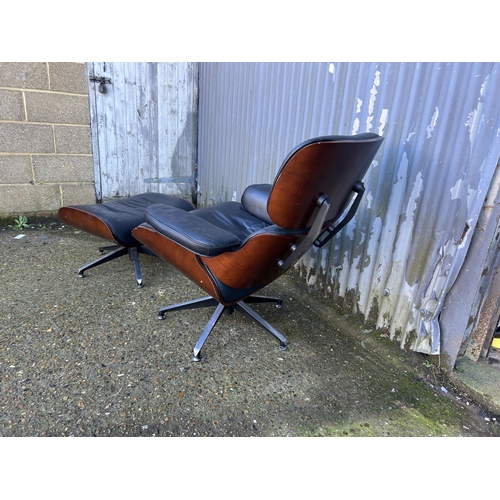 62 - A reproduction EAMES swivel chair and Ottoman footstool