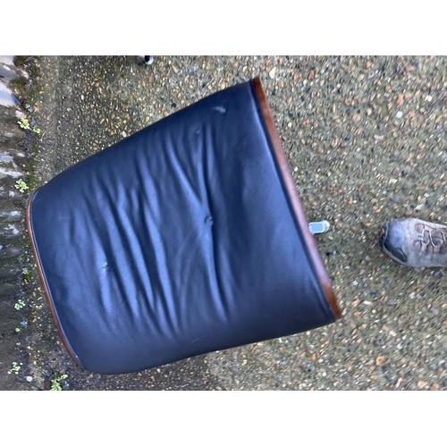 62 - A reproduction EAMES swivel chair and Ottoman footstool