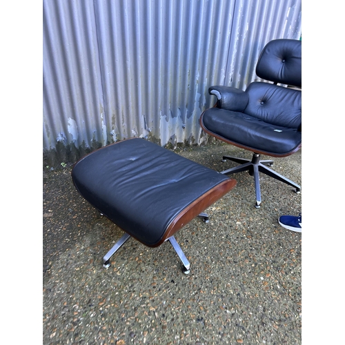 62 - A reproduction EAMES swivel chair and Ottoman footstool