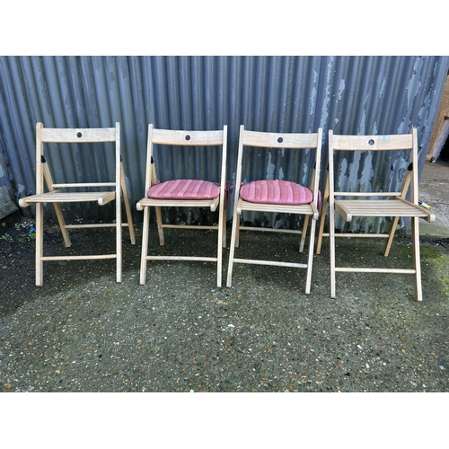 7 - A set of four folding chairs