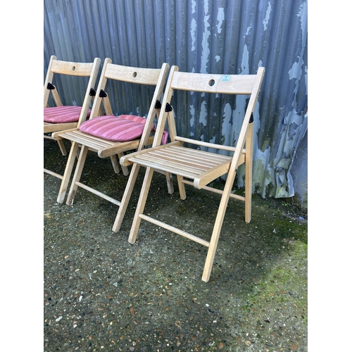 7 - A set of four folding chairs