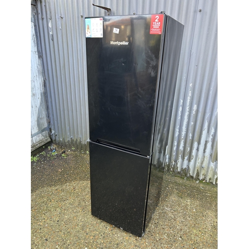 74 - A black fridge freezer