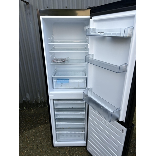 74 - A black fridge freezer