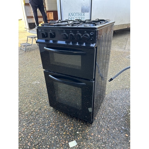 77 - A black gas cooker