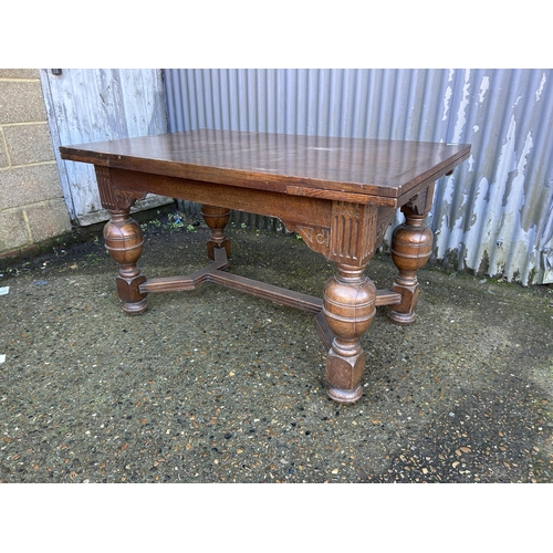 87 - A large oak drawer leaf table 137x84x74