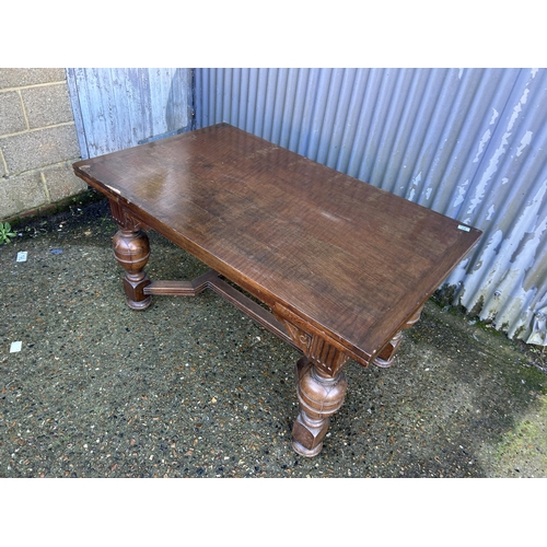 87 - A large oak drawer leaf table 137x84x74