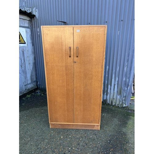 93 - A mid century g plan light oak wardrobe  90x54x180