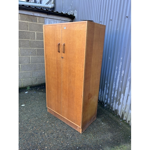 93 - A mid century g plan light oak wardrobe  90x54x180
