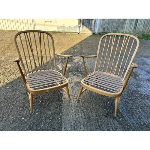 95 - A pair of ercol light elm armchairs