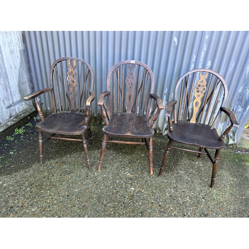 96 - Three wheel back carver chairs