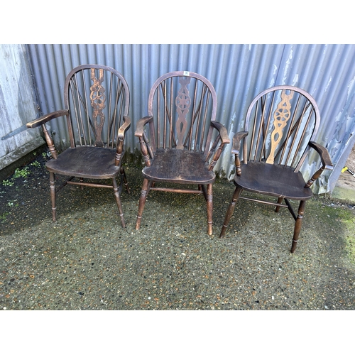 96 - Three wheel back carver chairs
