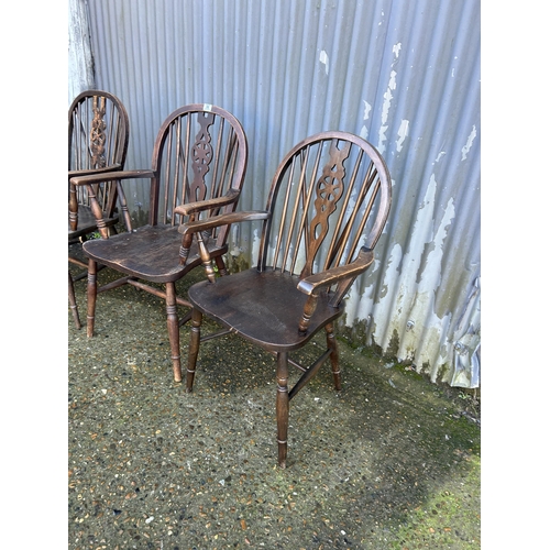 96 - Three wheel back carver chairs