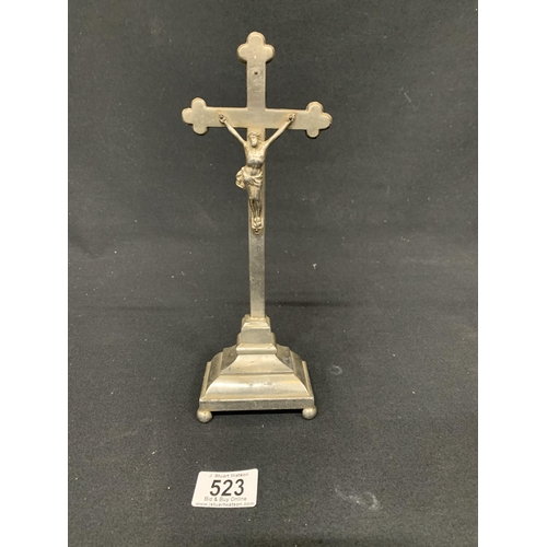 523 - White metal Corpus Christy cross on stand, height 26cms to top of cross