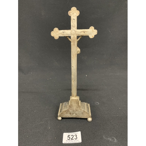 523 - White metal Corpus Christy cross on stand, height 26cms to top of cross