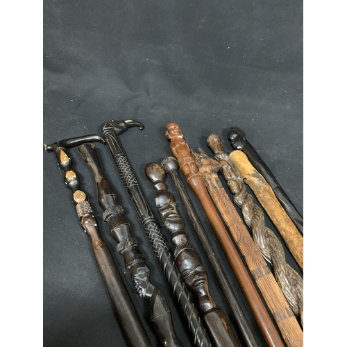 624 - A collection of 10 African carved walking sticks