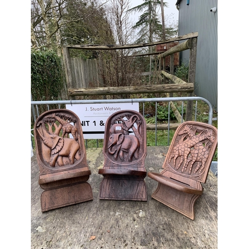 715 - Three African carved two piece chairs, tallest height 53 cms