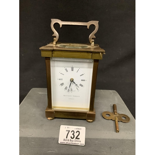 732 - Brass Carriage  Clock with key - Matthew Norman London, height 16 cms, running