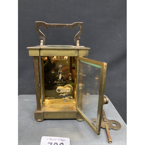 732 - Brass Carriage  Clock with key - Matthew Norman London, height 16 cms, running