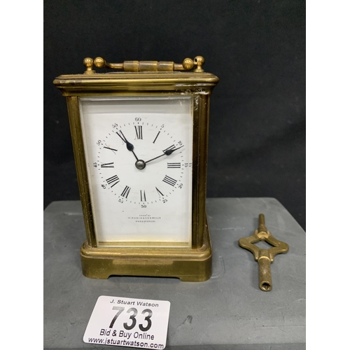 733 - French Brass striking Carriage Clock with key, height 11 cms