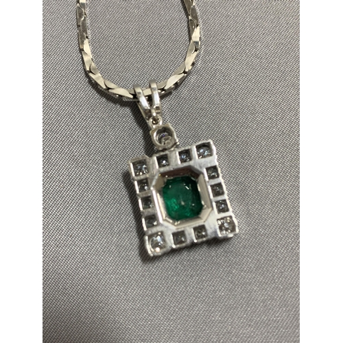 850 - 14ct White Gold Emerald and diamond pendant necklace, suspended on a white chain marked 585, total w... 