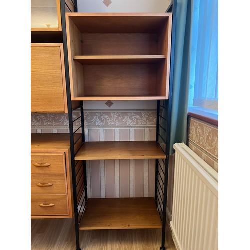 316 - A mid century teak ladderax wall shelving system