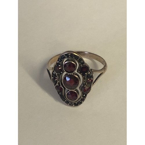 846 - A  gold garnet set fingerline ring, with split shoulders and a polished shank (unmarked) together wi... 