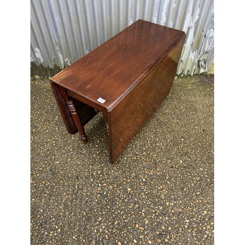 100 - A mahogany drop leaf table