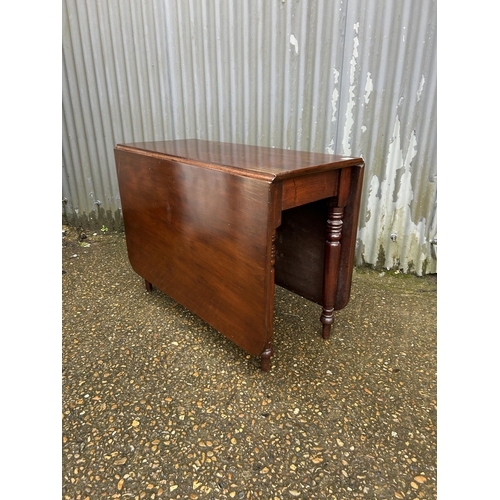 100 - A mahogany drop leaf table