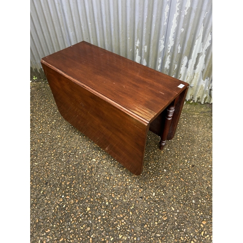 100 - A mahogany drop leaf table