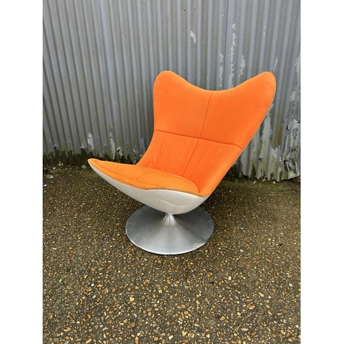 101 - A mid century orange upholstered swivel chair